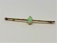 A 15ct gold opal bar brooch