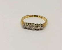 An 18ct gold five stone diamond ring, size M/N, 2.5g.
