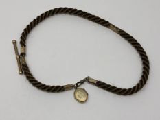 An antique hair Albert chain with gold T-bar, dog-catch and fittings.