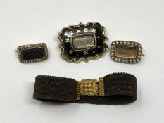 A collection of Georgian and Victorian mourning jewellery including gold mounted hair bracelet.