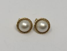 A pair of 18ct gold mabe pearl earrings.