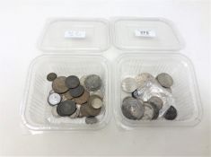 A tub of miscellaneous British coins including a Charles II 1st issue shilling (poor),