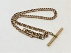 A 9ct gold pocket watch chain, with gold plated T-bar, approximately 29g.