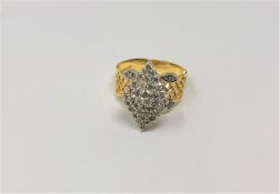 A 10ct yellow gold diamond set cluster ring,