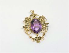An antique gold pearl amethyst brooch / pendant