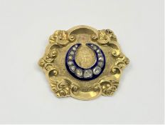 A yellow metal blue enamel and diamond brooch, 16.29g.