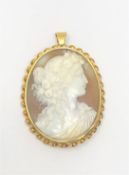 A large antique gold framed cameo pendant.