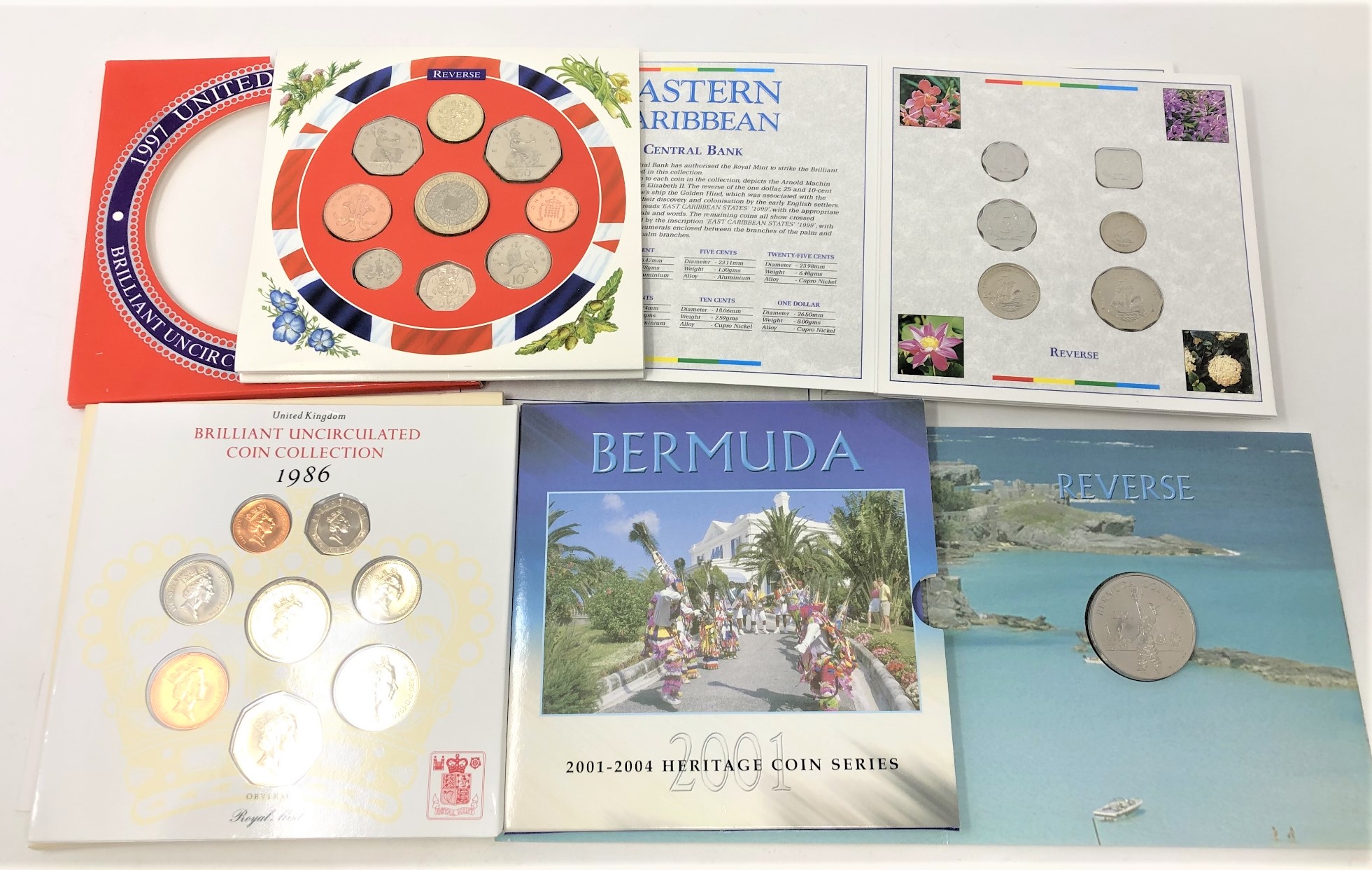 Four coin collection issues - Year 2000 Eastern Caribbean central bank, 2001 Bermuda coin series,