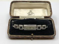 An antique platinum and diamond watch, set with approximately 100 diamonds, approximately 2.