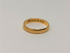 A 22ct gold band ring, size N/O, 2.5g.