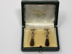 A pair of gold citrine earrings, boxed.