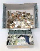 A large quantity of world coins, Bank of England £1 notes, 10 Shilling notes,