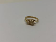 An 18ct gold double diamond cluster ring, 2.77g.