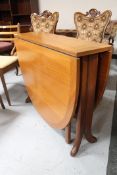 A Nathan teak drop leaf table