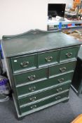 A reproduction five drawer painted chest
