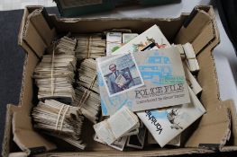 A box of cigarette and tea cards