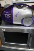 A Morphy Richards bagless vac together with stainless steel microwave