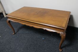 Two walnut coffee tables together with a nest of tables