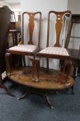 A pair of Queen Anne style dining chairs together with an inlaid mahogany and brass oval occasional