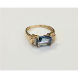 A 10ct gold blue topaz and diamond ring,