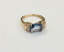 A 10ct gold blue topaz and diamond ring,