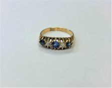 An antique 18ct gold sapphire and diamond ring