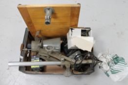 A box of photographic enlarger, lens,