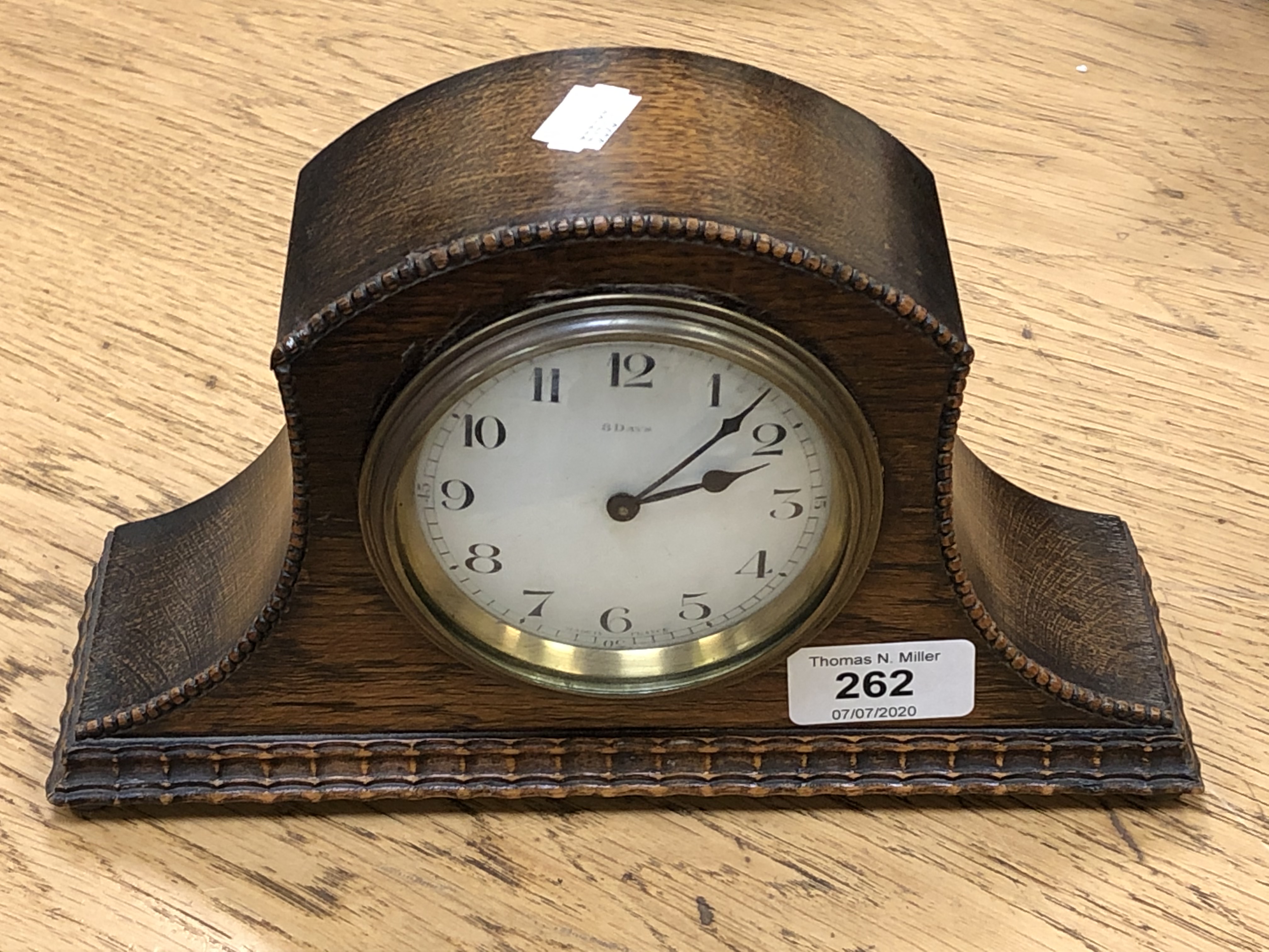 An Edwardian oak 8 day mantel clock