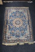 A Persian rug on blue ground,