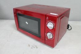 A red microwave oven