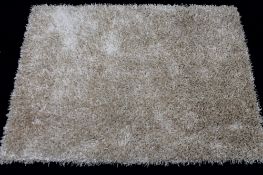 A contemporary shaggy piled rug