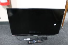 A Samsung 32 inch LCD TV with remote