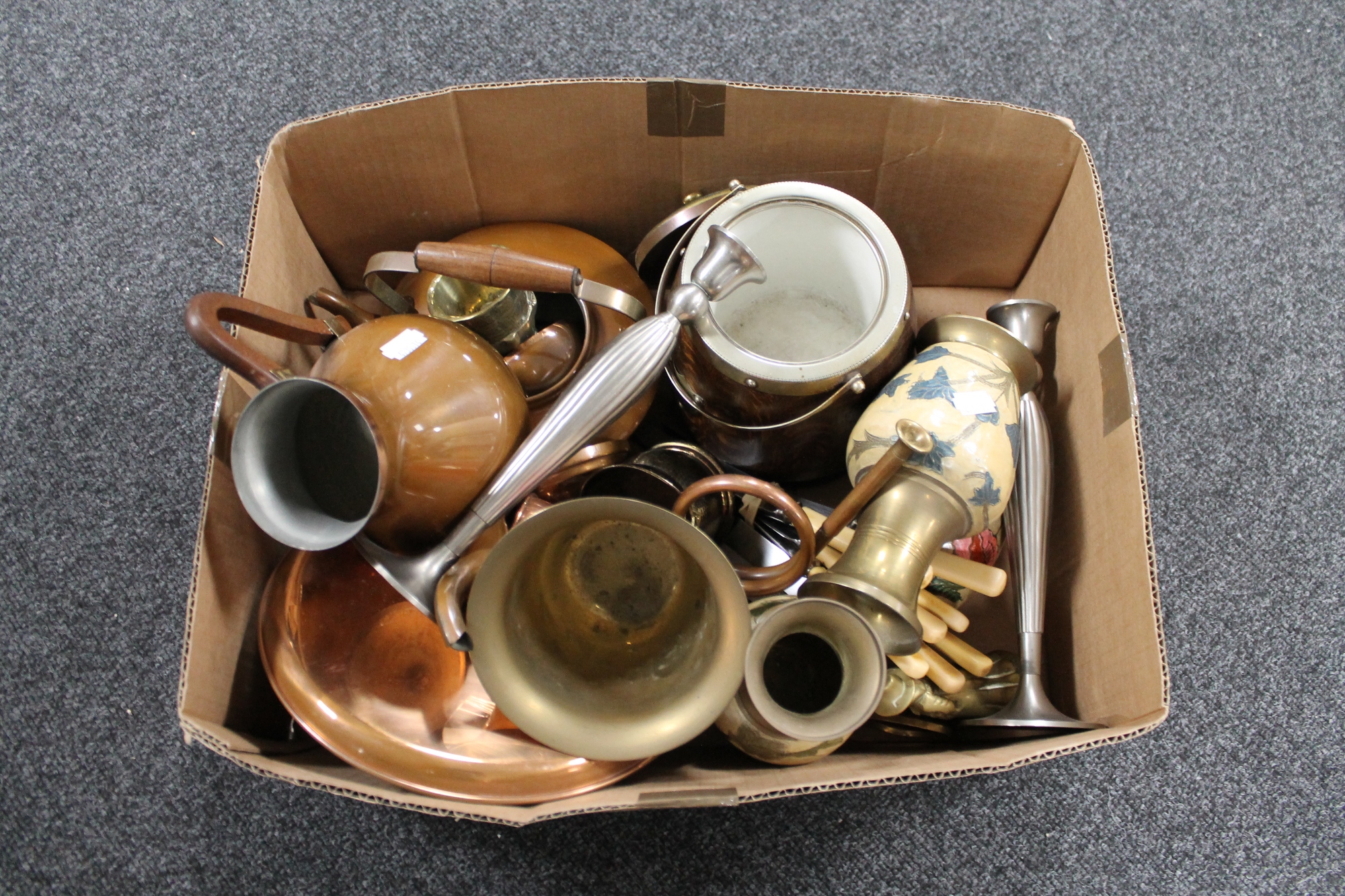 A box of brass and copper items, cutlery,