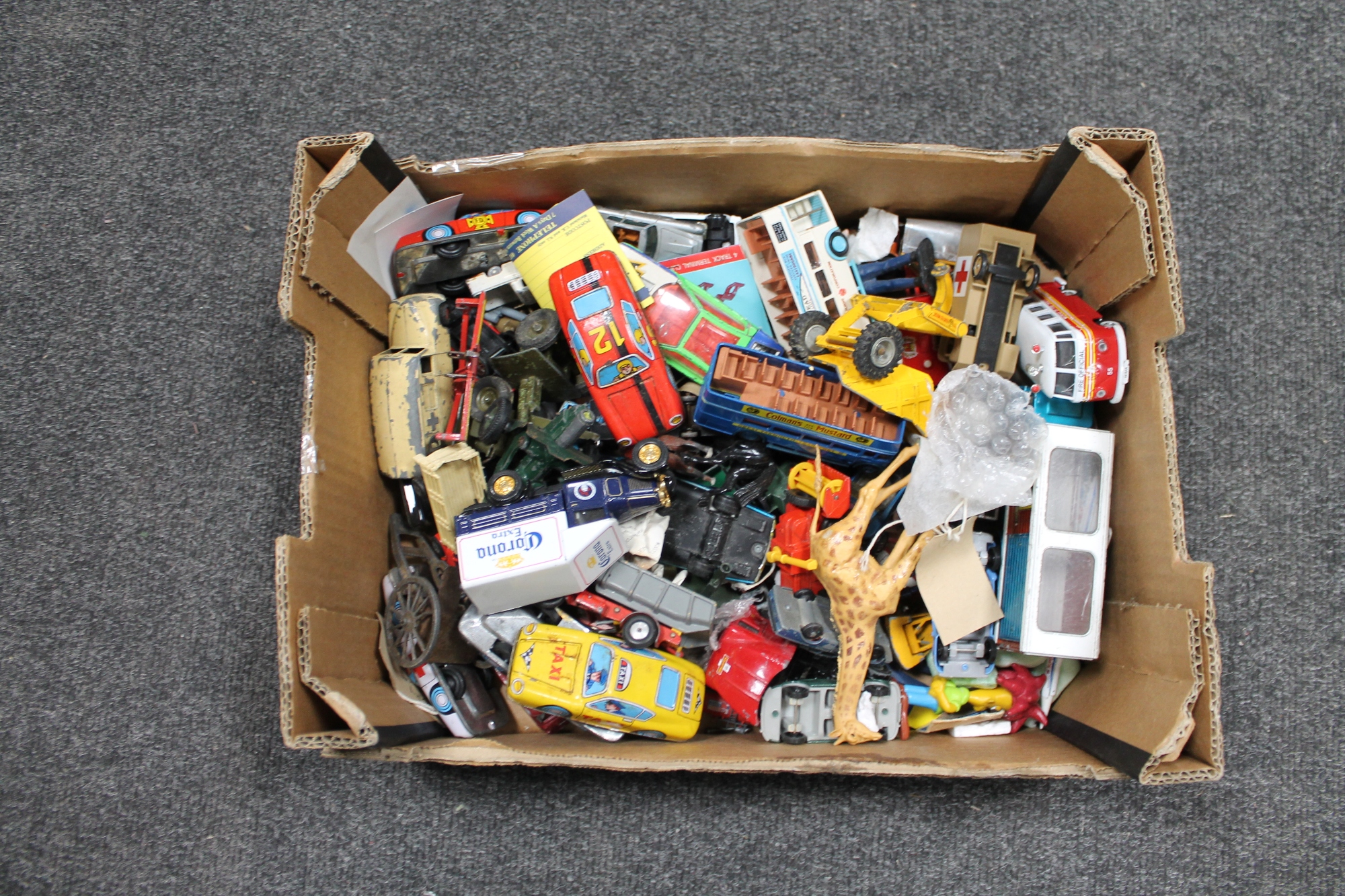 A box of die cast vehicles,