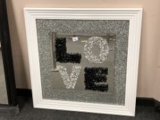 A contemporary framed 'Love' mirror