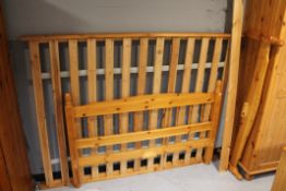A pine 4'6" bed frame