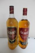 Two bottles of whisky - Grants Blended Scotch 1l and Grants Triple Wood blended scotch 1l.