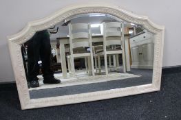 A heavy marble effect bevelled overmantel mirror CONDITION REPORT: 108cm by 71cm.