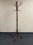 A reproduction hat and coat stand