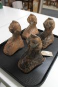 A set of four antique cast metal bath feet