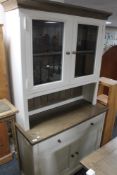 A contemporary farmhouse white painted kitchen dresser