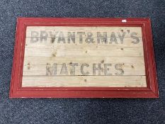 A Bryant & May's Matches advertisement on board in frame