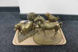 A tray of brass horse ornaments
