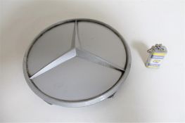 A Mercedes Benz bumper badge