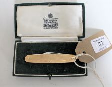 A folding pocket knife with 9ct gold front and back