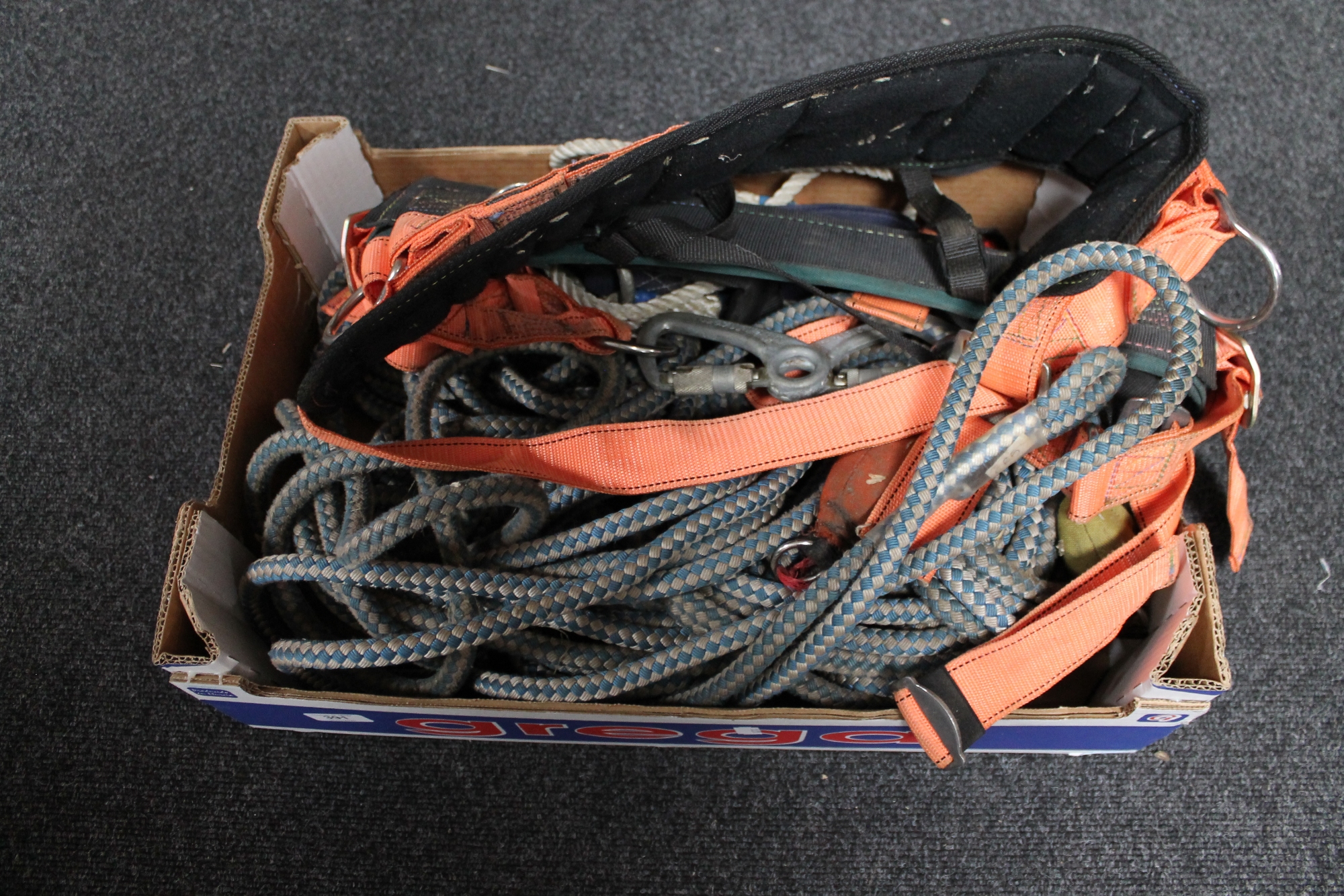 A box of tree surgeon ropes and harnesses