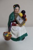 A Royal Doulton figure - The old balloon seller HN 1315