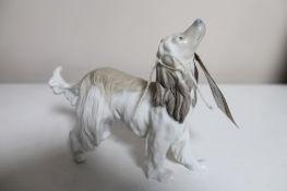 A Lladro figure - hound CONDITION REPORT: Back leg damaged.