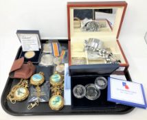 A tray of replica WWI medals, spitfire pocket watches,