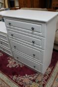 A contemporary four drawer chest of drawers together with three further pieces of white laminated